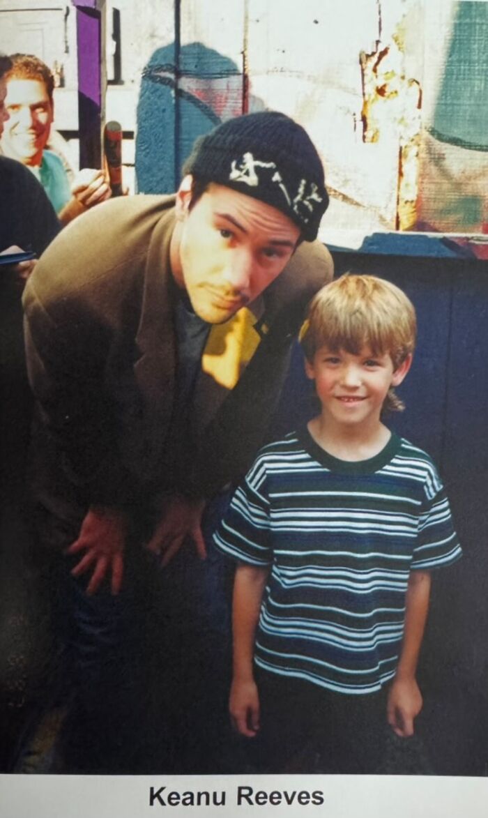 Young boy smiling with a celebrity in a casual setting, capturing a memorable moment from childhood experiences with famous people.