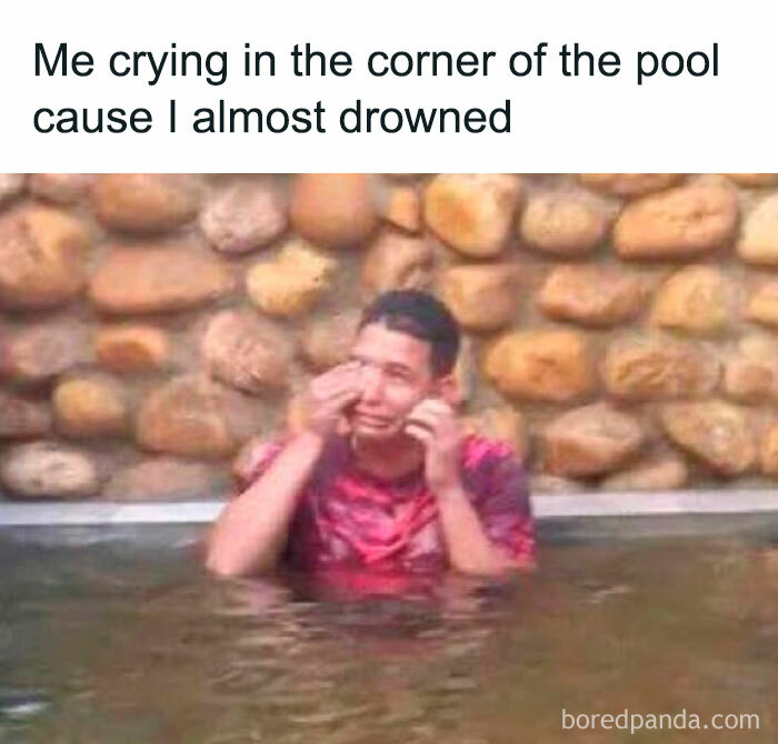 Person in a pool corner crying, humorously illustrating a random funny meme with a stone wall backdrop.
