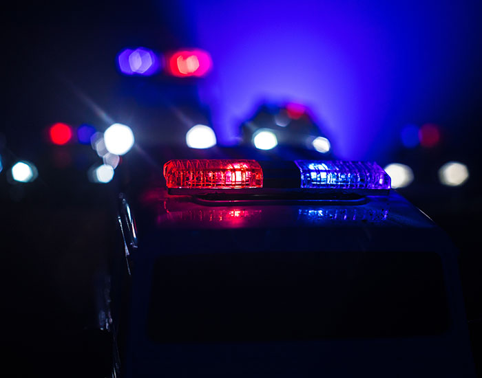 Police car with flashing lights related to missing teen girl case. Police car with flashing lights related to missing teen girl case.