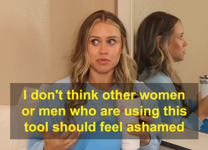 Fitness influencer addressing weight loss controversy while holding a beverage, seated near a mirror in casual attire. Fitness influencer addressing weight loss controversy while holding a beverage, seated near a mirror in casual attire.