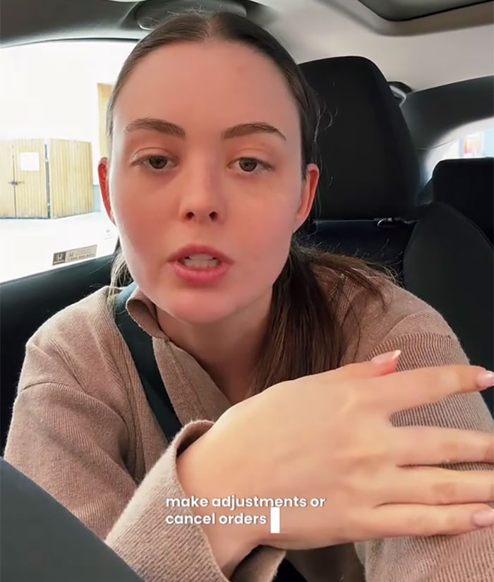 A small business owner in the US discusses tariffs' impact, sitting in a car, wearing a brown jacket.