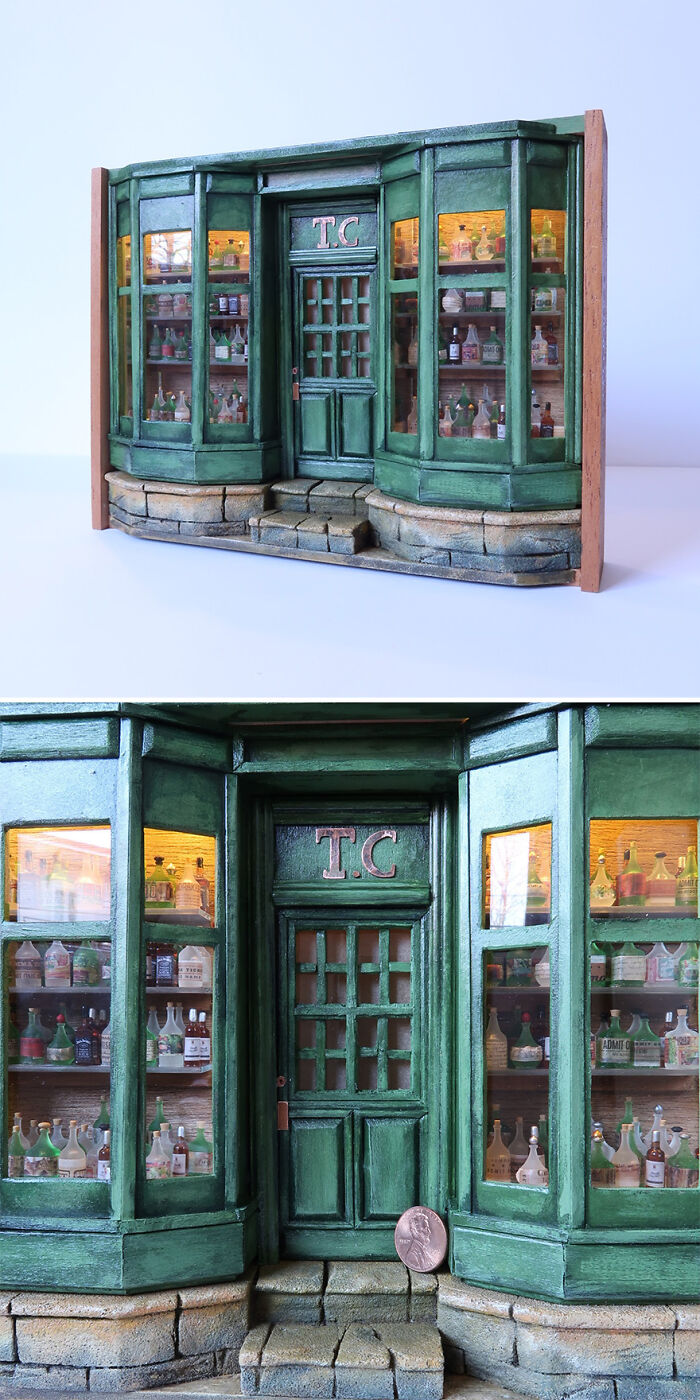 Miniature storefront by Tamar Cohen, showing detailed green facade with a penny for scale.