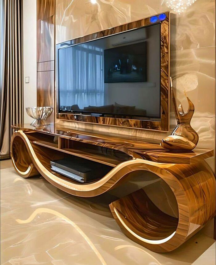 Mueble moderno de madera con diseño curvo y acabado brillante mostrando habilidades en proyectos con la madera.