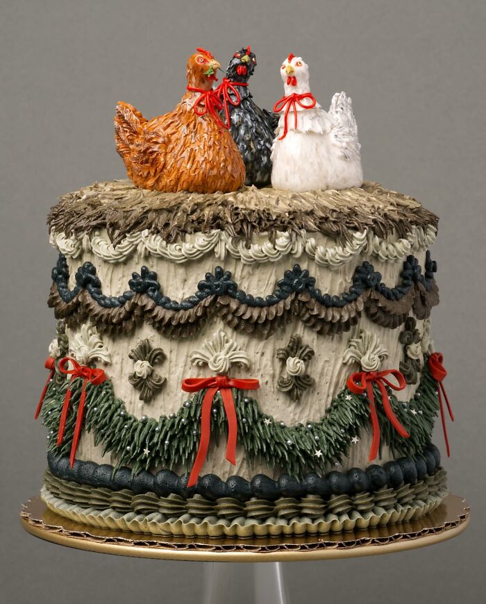 Vegan cake featuring chicken decorations and intricate icing details, highlighting creative cake design.