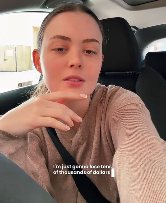 Small business owner in a car discussing the negative impact of new tariffs on her company.