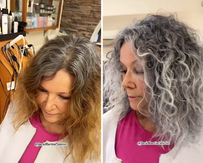 Woman embracing natural gray hair transformation, showcasing a stylish curly look in a salon setting.