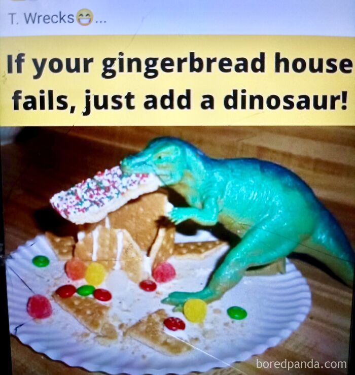Toy dinosaur biting a broken gingerbread house with candy, illustrating a silly dad humor joke about fixing fails.