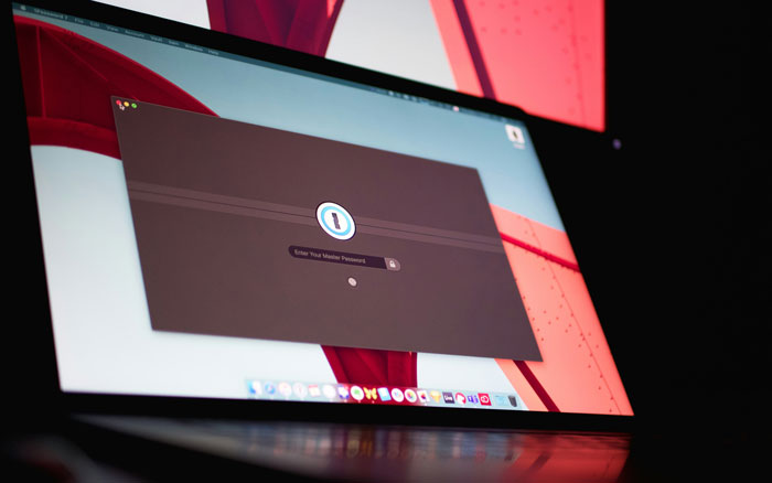 Laptop screen showing a password manager app used for internet hacks to simplify life online.