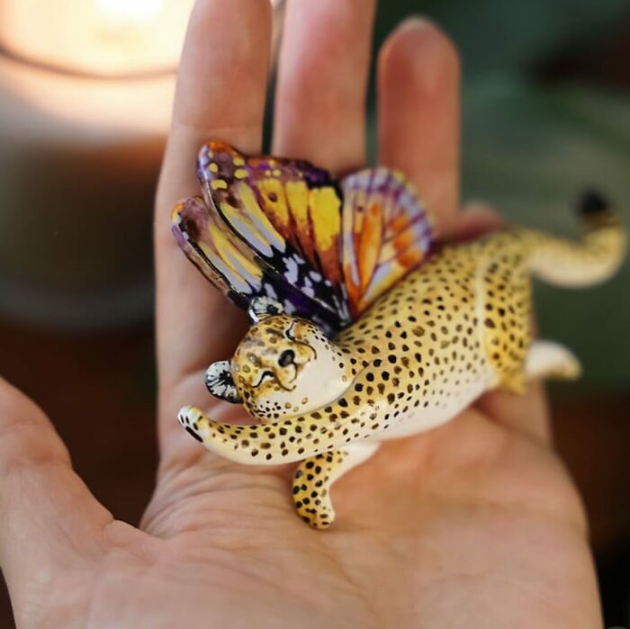 Hand holding a pocket-sized animal figurine with wings, designed by Vallavica.