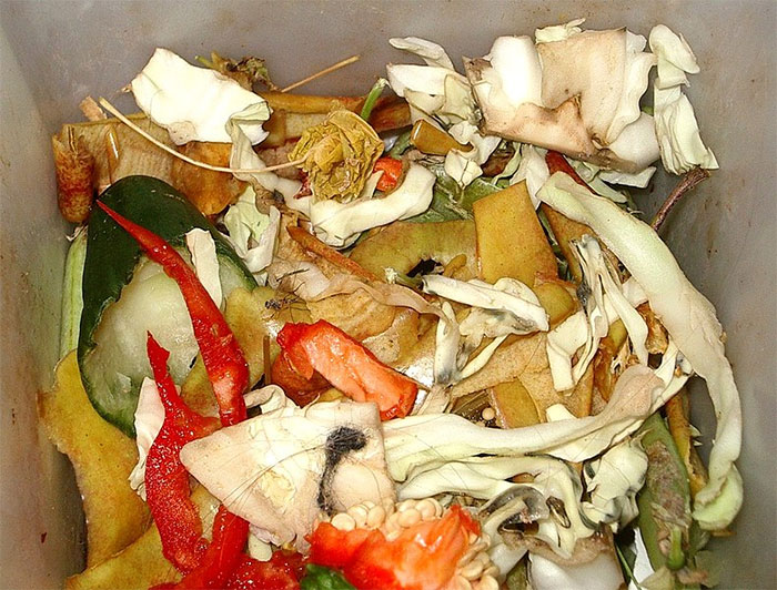 Kitchen chaos with food scraps in a messy pile, highlighting break policy impact.