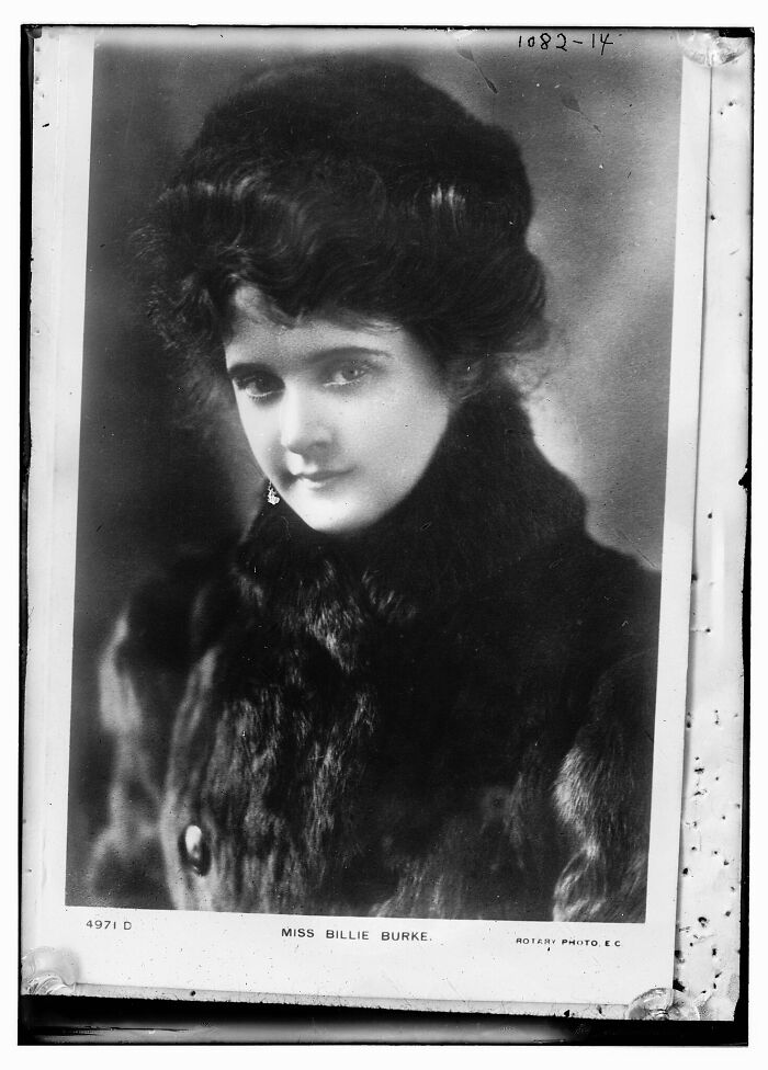 Vintage black and white portrait of a woman in a fur coat from rare photographs rescued from glass negatives.