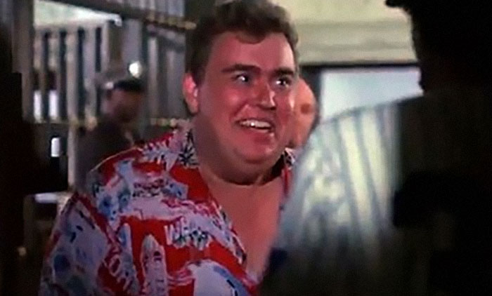 Smiling man in a colorful shirt, captured in a joyful moment, representing beloved stars' wholesome qualities.