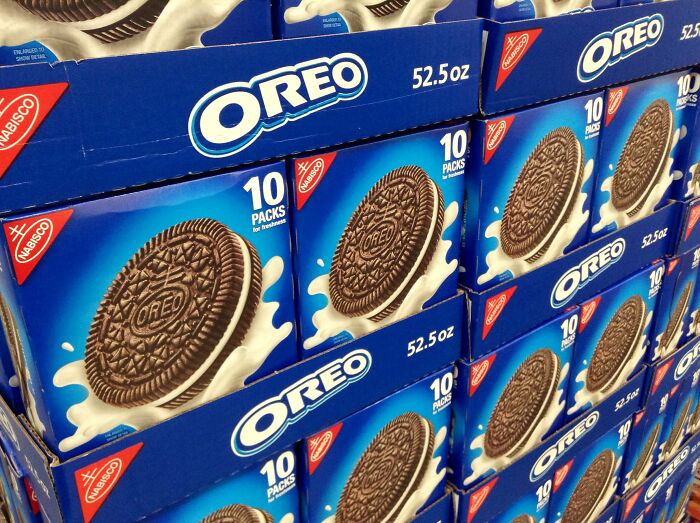 Stacks of Oreo cookie packs displayed on shelves, illustrating popular restaurant food items impacted by price increases.