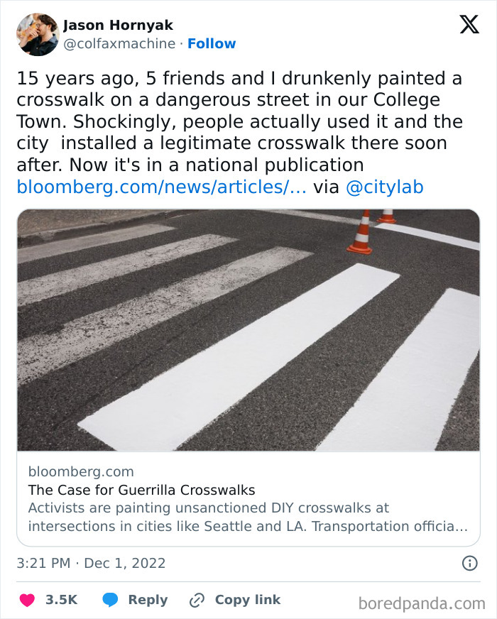DIY crosswalk painted on a street with traffic cones, highlighting city planners' oversight.