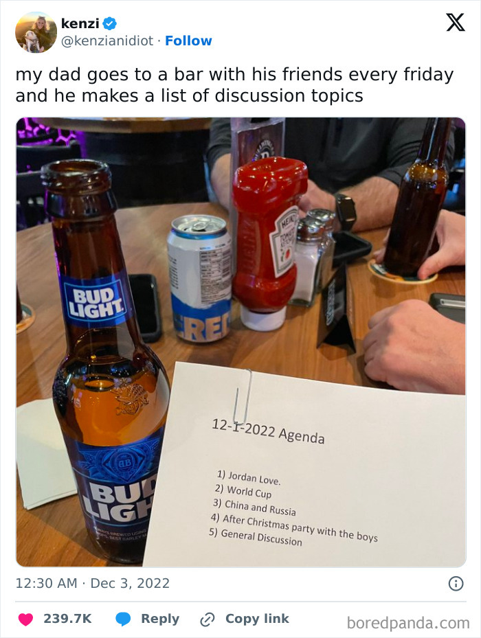 Beer bottles and a printed agenda with discussion topics on a wooden table, capturing pure and uplifting moments.