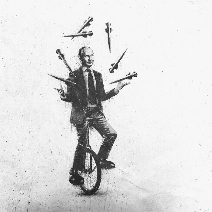Person on a unicycle juggling missiles, reflecting modern madness in artwork.