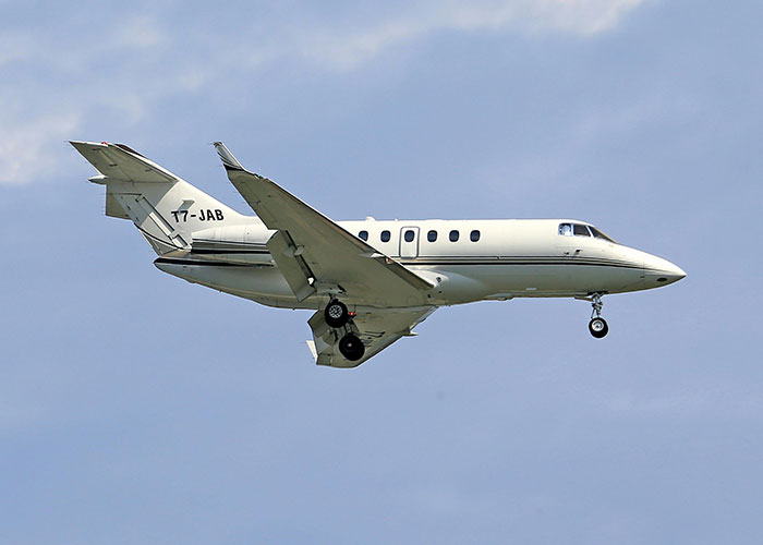 Plane flying against a blue sky, illustrating surprising in-flight actions.
