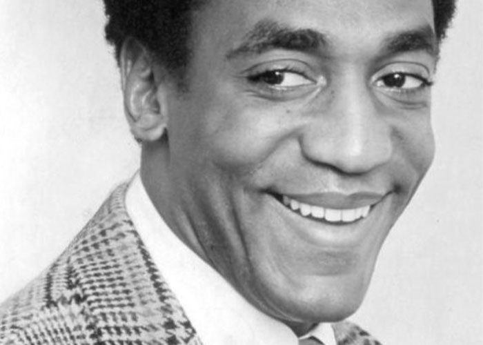 Smiling man in a plaid jacket, related to wild rumors that proved true.