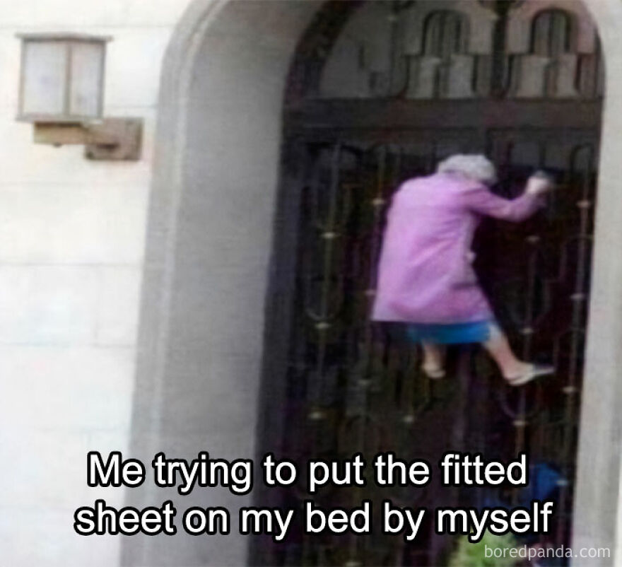 Elderly woman in pink climbing gate, humorously compared to struggles with fitted sheets.