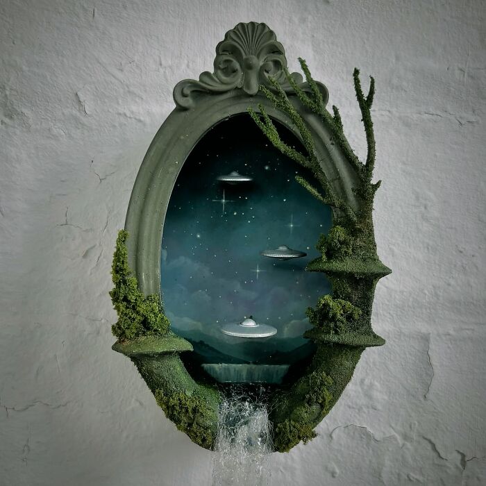 Alien diorama with UFOs in a mystical forest setting by Caroline Dewison.