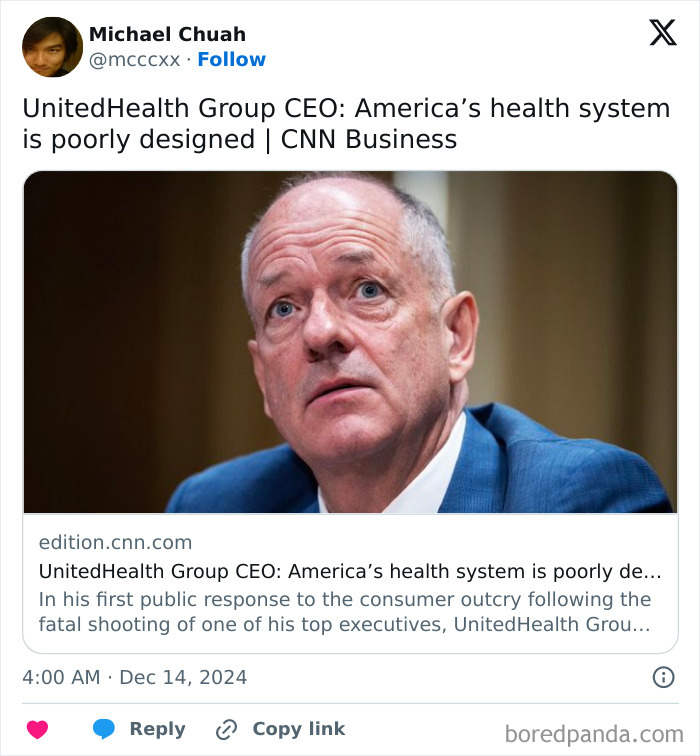 Man in a suit, concerned, discussing health system issues at a conference.