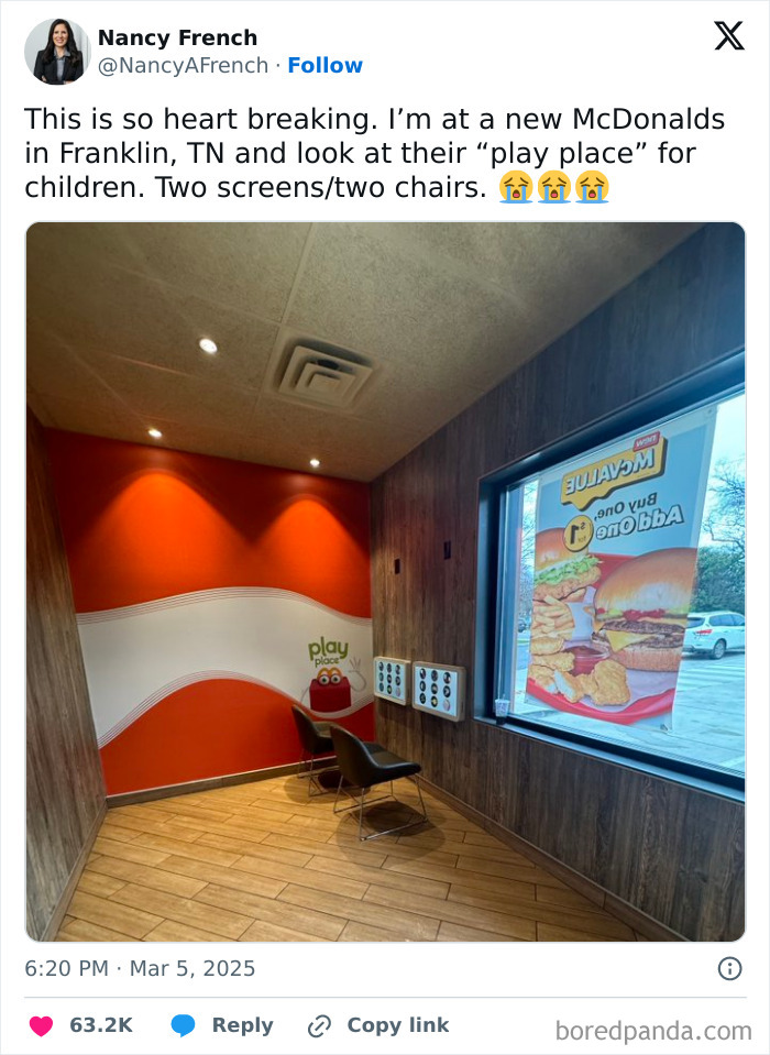 Small McDonald's play place with two screens and two chairs, reflecting current life in the US through Americans' eyes.