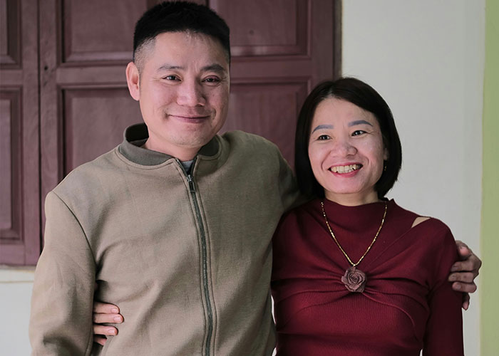 A couple posing happily together indoors.