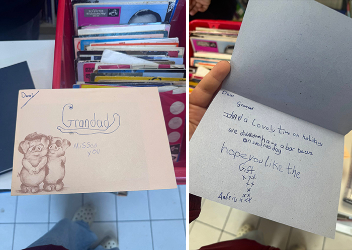 Secondhand shop treasure: sentimental card for grandad with handwritten message and drawing, found among assorted items.