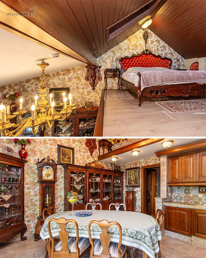 Ornate vintage bedroom and dining area with floral wallpaper, antique furniture, chandelier, and wooden kitchen accents in unique real estate property.