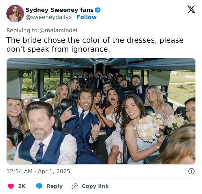 Sydney Sweeney in a light blue dress with wedding attendees on a bus, sparking online debate.