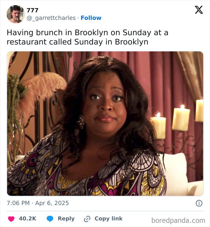 Woman reacting humorously, featured in one of the funniest tweets of April, with candles in the background.