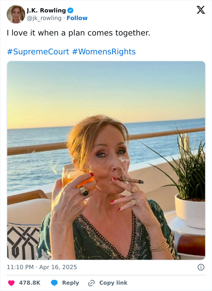 Person enjoying a drink and cigar on a boat, with sunset in the background.