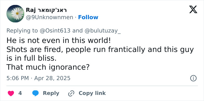 Tweet expressing shock at a tourist smiling and in bliss while a mass tragedy unfolds with shots fired and people running.