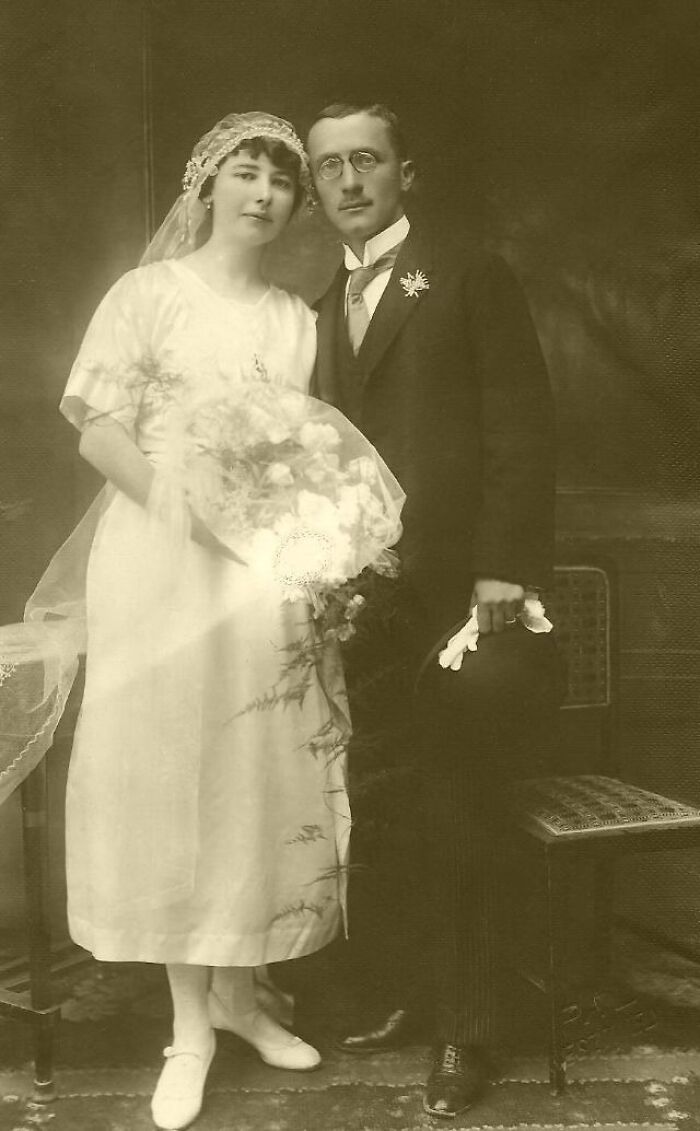 Vintage wedding photo of a bride and groom in early 20th-century attire, symbolizing timeless love.