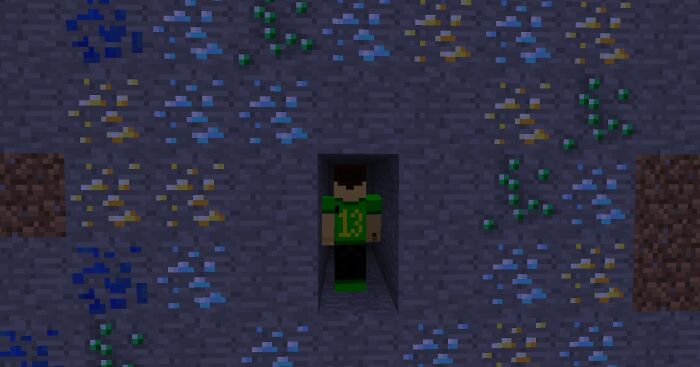 Pixelated character in a tunnel surrounded by colorful gems, illustrating a loophole in a game.