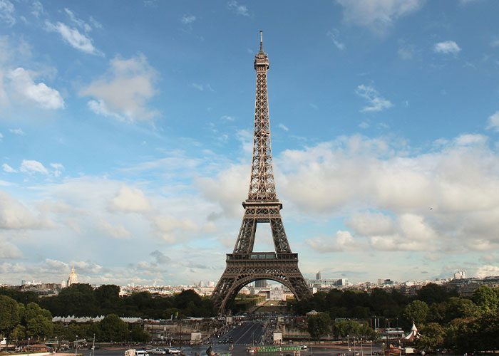 Eiffel Tower under blue sky, representing unrealistic movie settings.