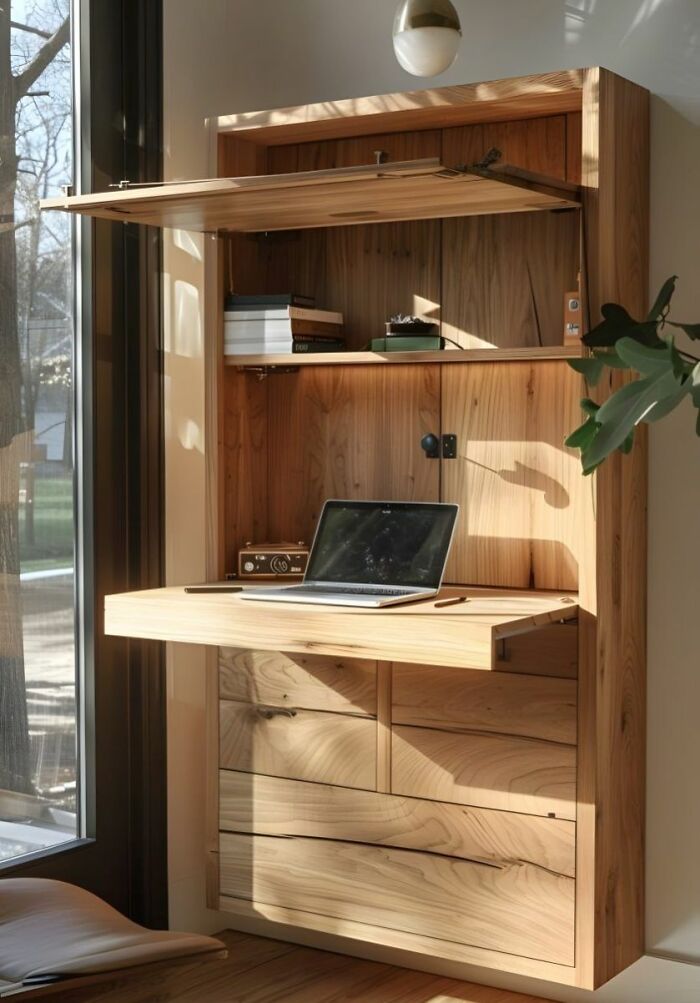 Wall-mounted wooden desk with shelves and drawers, showcasing functional woodworking ideas in natural light.