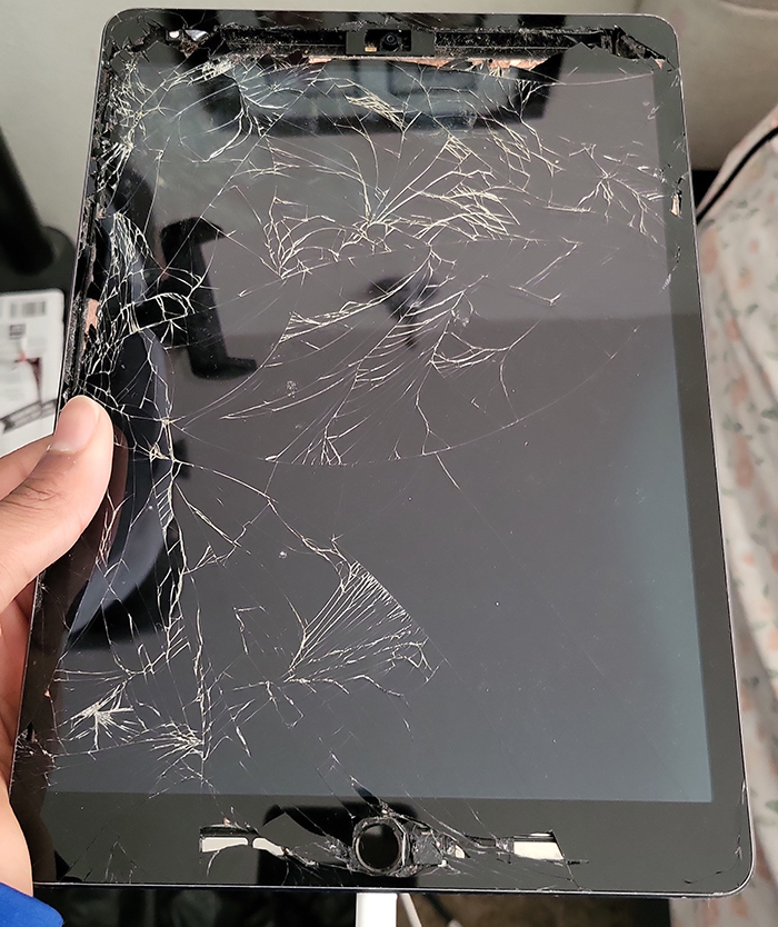 Shattered iPad screen after child ran amok at bowling alley.