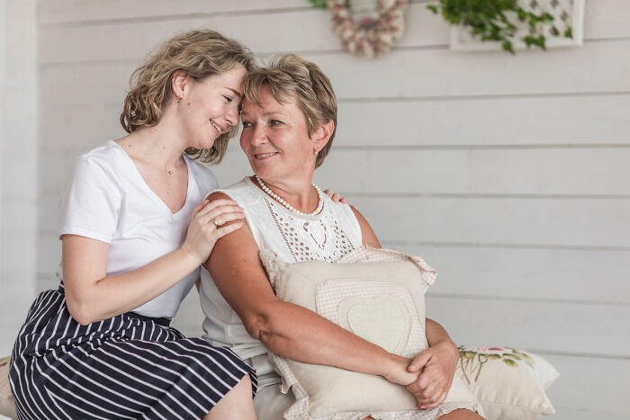 Mother and adult daughter share a close moment, capturing family dynamics and feelings around picking favorites.