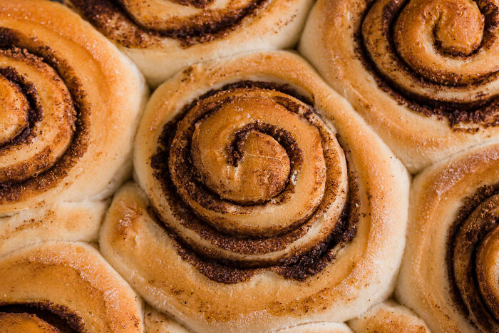 Close-up of cinnamon rolls, highlighting a unique American pastry popular for breakfast or dessert.