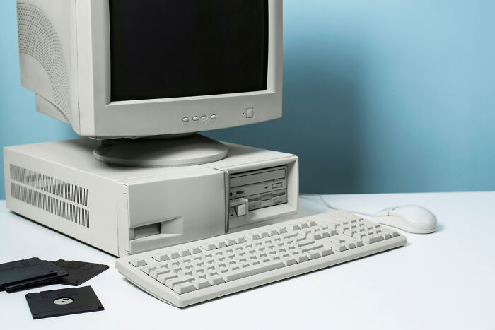Retro computer setup with CRT monitor and floppy disks, highlighting overlooked science peak.
