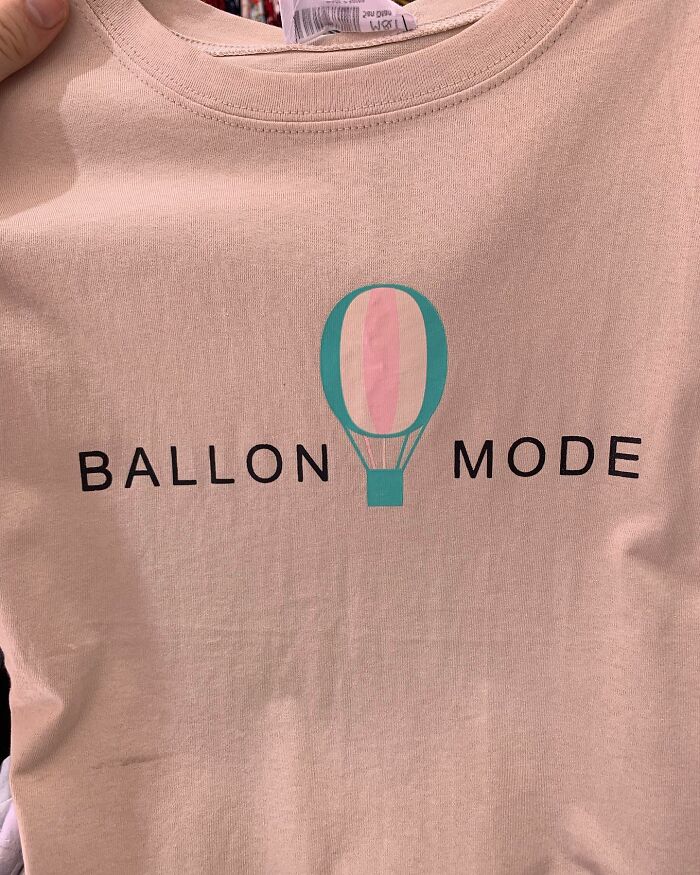 T-shirt with "BALLON MODE" and hot air balloon graphic, showcasing translation humor.