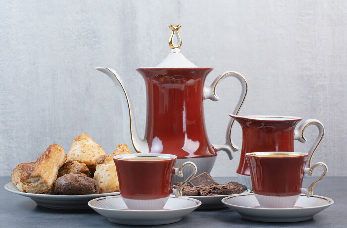 Elegant coffee set with pastries, showcasing affordable treats that appear fancy.
