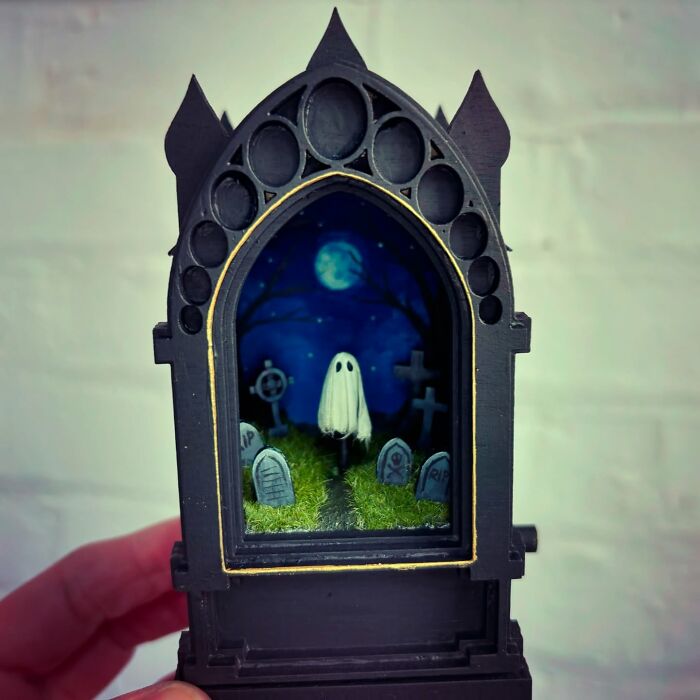 Graveyard diorama with ghost, ideal for alien and mystery enthusiasts, crafted by Caroline Dewison.