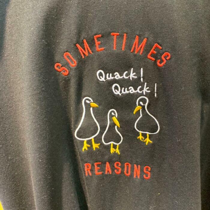 T-shirt with ducks and text "Sometimes Quack! Quack! Reasons" humorously lost in translation.