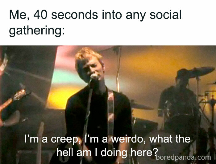 Musician singing on stage with caption about social awkwardness, relating to philosophy memes.