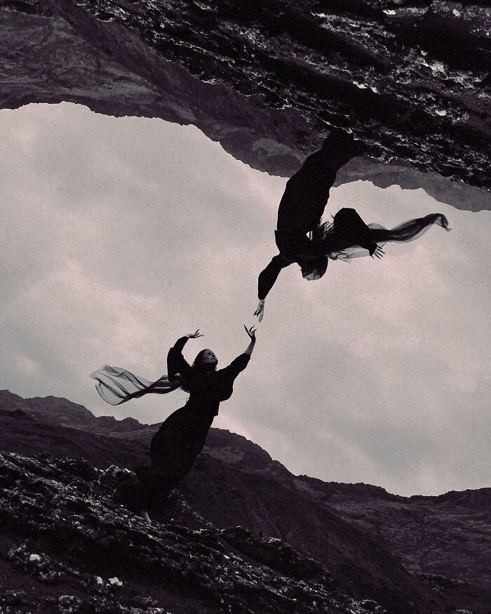 Dreamy dark escapism photography by Nona Limmen, featuring mirrored figures in dramatic landscape.