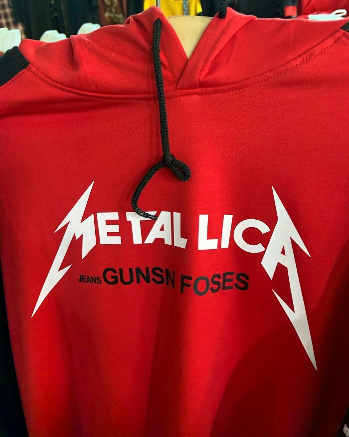 Red hoodie with humorous translation: "Metali Lica Jeans Gunsn Foses" design.