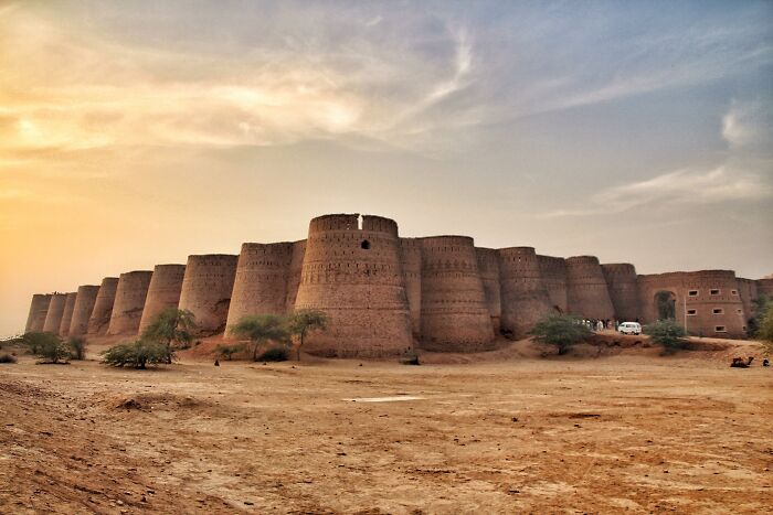 Ancient architectural wonder, Cholistan Desert fortress at sunset with dramatic sky.