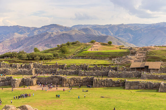 Ancient stone architecture with scenic mountain backdrop, depicting one of the lesser-known architectural wonders.